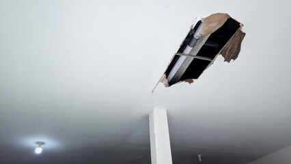 Collapsed ceiling from water leak. A water pipe leak caused a portion of the ceiling to collapse.
