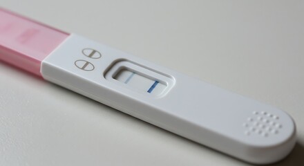 Positive Pregnancy Test with Two Blue Lines on White Background