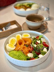 healthy bowl
stylish breakfast table with gourmet bowls, ceramic cups, warm natural light, and textured tablecloth. cozy, artisanal food scene for commercial use in lifestyle and hospitality