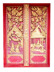 Fototapeta premium Ancient Thai Buddhist temple door decoration with a detailed golden angel sculpture and intricate cultural patterns
