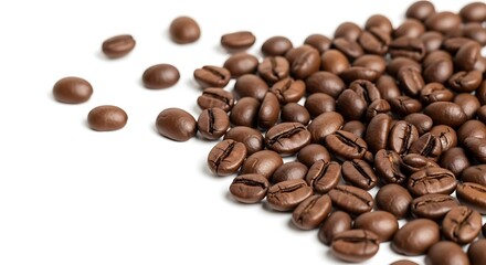 Obraz premium Pile of roasted coffee beans scattered on a clean white background isolated on white background
