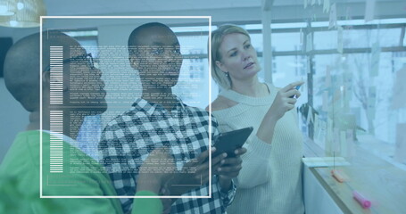 Collaborating male in checkered shirt holding tablet in office, with sticky notes and code overlay