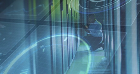 Kneeling technician in shirt examining servers in data center aisle, with HUD overlays