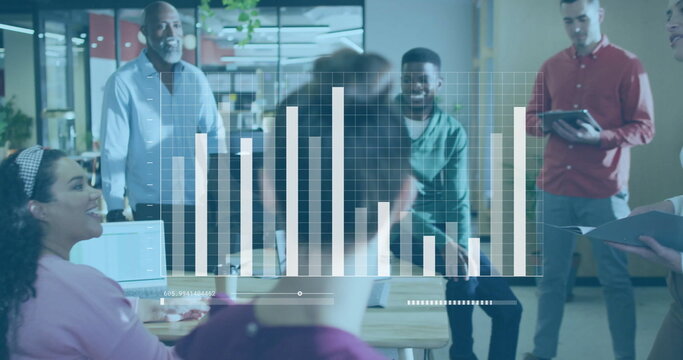 Analyzing five colleagues in colorful shirts examining bar graph overlay in open-plan office