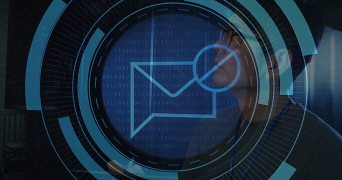 Technician monitoring racks in server room corridor, ID badge and digital interface, copy space