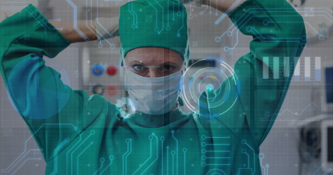 Female surgeon in green scrubs and face mask adjusting cap in operating room, with digital overlay