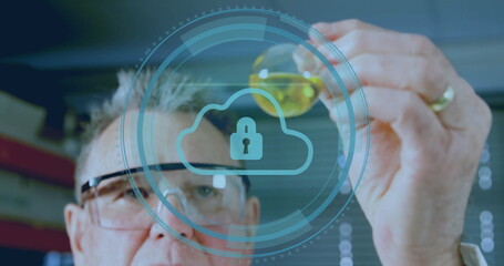 Examining senior scientist wearing goggles holding flask with yellow liquid in lab, cloud lock icon