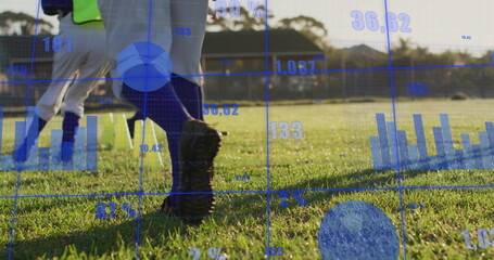 Dribbling soccer player wearing shin guards and cleats with neon vest on grassy field, data overlay