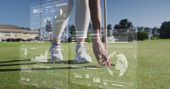 Positioning golfer wearing golf attire placing golf ball at pin on putting green with holograms