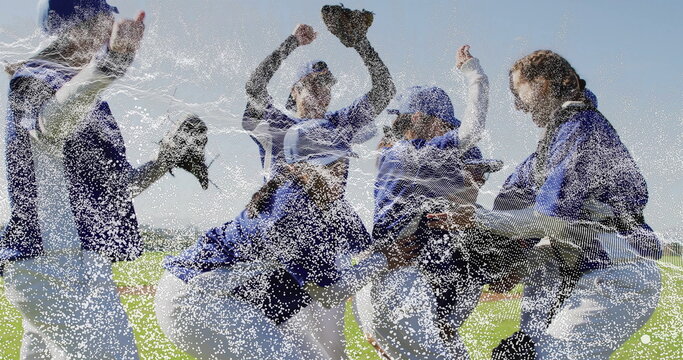 Celebrating softball players raising arms on outfield, wearing jerseys caps cleats holding glove - Powered by Adobe
