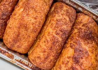 Closeup of the famous cinnamon bread in an aluminum pan at Dollywood theme park