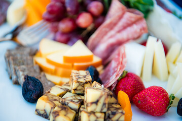 Cheese, meat, fruit tray at a corporate event.