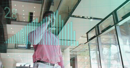 businessman scrolling smartphone in lobby and initiating rising bar chart for data analysis - Powered by Adobe