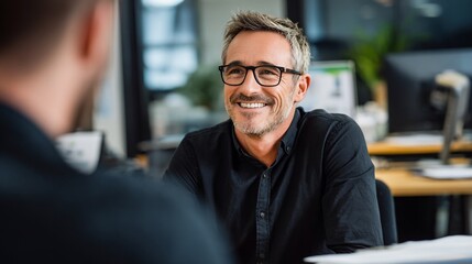 Interviewee Smiling During Conversation at Office