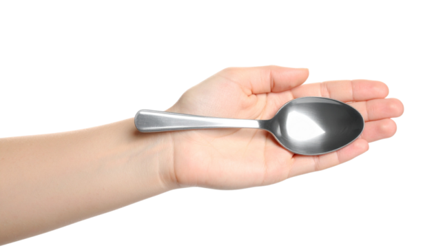 Female hand holding a spoon isolated on transparent or white background