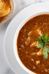 Bowl of soup with bread