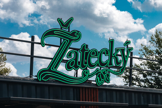 POLAND, GDANSK, AUGUST 9, 2025: Zatecky (Žateck&yacute;) Beer Neon Banner with Hops &mdash; Czech Brewery Logo