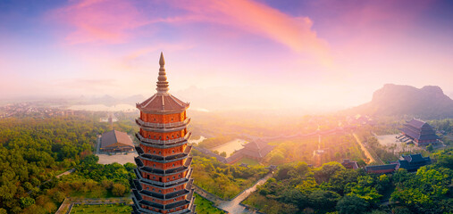 Sunset over bai dinh pagoda in Ninh Binh Vietnam with scenic panorama landscape
