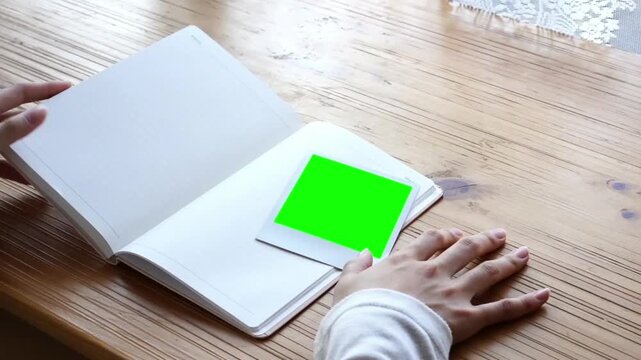 polaroid green screen fot editing background book and hand 