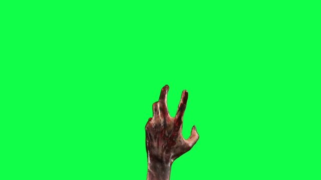 Zombie hand reaching out on green screen for compositing and special effects