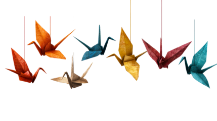 Ornate paper cranes suspended by threads against a neutral surface