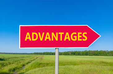 Advantages symbol. Concept word Advantages on beautiful red road sign. Beautiful blue sky green grass and forest peaceful nature background. Business advantages concept. Copy space.