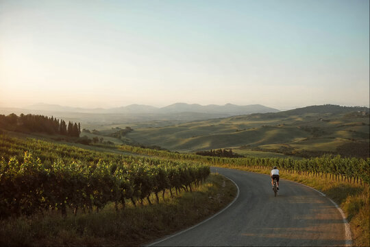 Biker on the road to the mountains