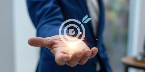 Business Goal - A man's hand holding a glowing target with an arrow, symbolizing a clear business goal and strategic focus