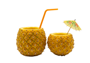 Pineapple drink in fruit shell with straw and umbrella transparent background