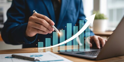 Business Growth - A businessman's hand using a digital pen to interact with a glowing bar chart and a rising arrow, for successful financial strategy