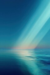 Obraz premium Serene ocean surface under soft pastel sunrise and streaming sunlight
