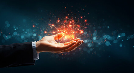 A hand in a suit holds a glowing, interconnected network of red particles against a dark, bokeh-filled background, symbolizing connection and innovation.