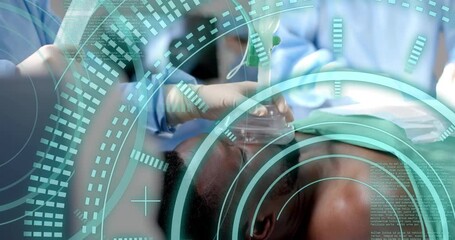 Gloved nurse ventilating patient with mask showing digital monitoring and surgeon activating light - Powered by Adobe