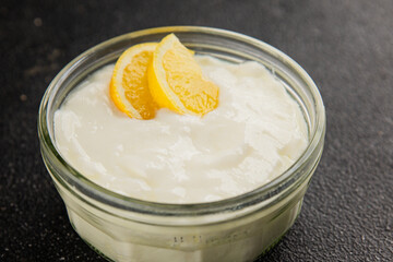 Lemon yogurt natural product skyr sour milk skir fresh delicious gourmet food background on the table rustic food top view copy space keto and paleo diet vegetarian food