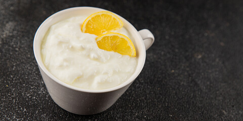 Lemon yogurt natural product skyr sour milk skir fresh delicious gourmet food background on the table rustic food top view copy space keto and paleo diet vegetarian food
