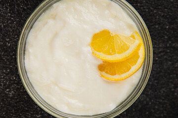 Lemon yogurt natural product skyr sour milk skir fresh delicious gourmet food background on the table rustic food top view copy space keto and paleo diet vegetarian food