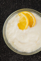 Lemon yogurt natural product skyr sour milk skir fresh delicious gourmet food background on the table rustic food top view copy space keto and paleo diet vegetarian food