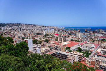 Fototapeta premium Alger the capital city of Algeria, North Africa, city centre of Algiers, the capital of Algeria, Landscape of Algiers city With port and mediterranean sea and white buildings, Arab Maghreb Africa.