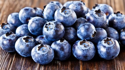 Full-frame macro shot at 50mm focal length, scattered blueberries transitioning in size order, front row in sharp focus, soft daylight illumination for natural tones