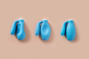 Three vaginal kegel smart trainers with varying degrees of inflation to track muscle strength, vaginal tightness for woman and training progress. View from above.