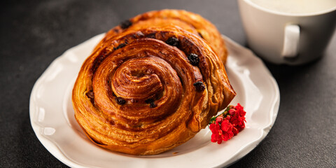 Raisin bun sweet pastry dessert puff pastry fresh delicious gourmet food background on the table rustic food top view copy space