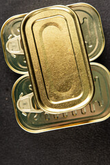 Can tin canned food fish or meat, tin can vegetable fresh delicious gourmet food background on the table rustic food top view copy space