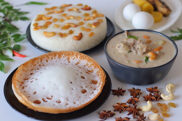 Kerala style breakfast with appam, vattayappam, mutton stew, steamed ethakka, and boiled eggs