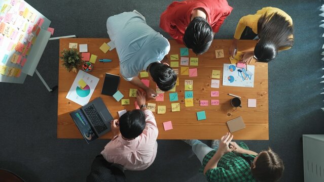 Top view of project manager working while marketing team support her performance. Caucasian businesswoman working together with group of smart people choose idea at meeting. Time lapse. Convocation. - Powered by Adobe