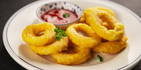 Colmar rings fried food fries fast food crispy appetizer fresh delicious gourmet food background on the table rustic food top view copy space