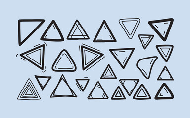 Collection of hand drawn geometric triangle shapes on a light blue background