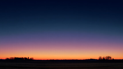 Obraz premium Dusk sky gradient over silhouetted trees and landscape sunset twilight