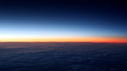 Fototapeta premium Deep blue sky gradient above orange horizon and dark clouds sunset sunrise