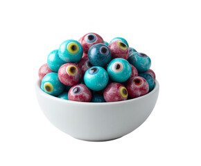 A close-up of a white bowl filled with candy eyeballs, ready to eat.