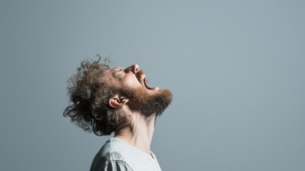 Bearded man shouts toward the sky